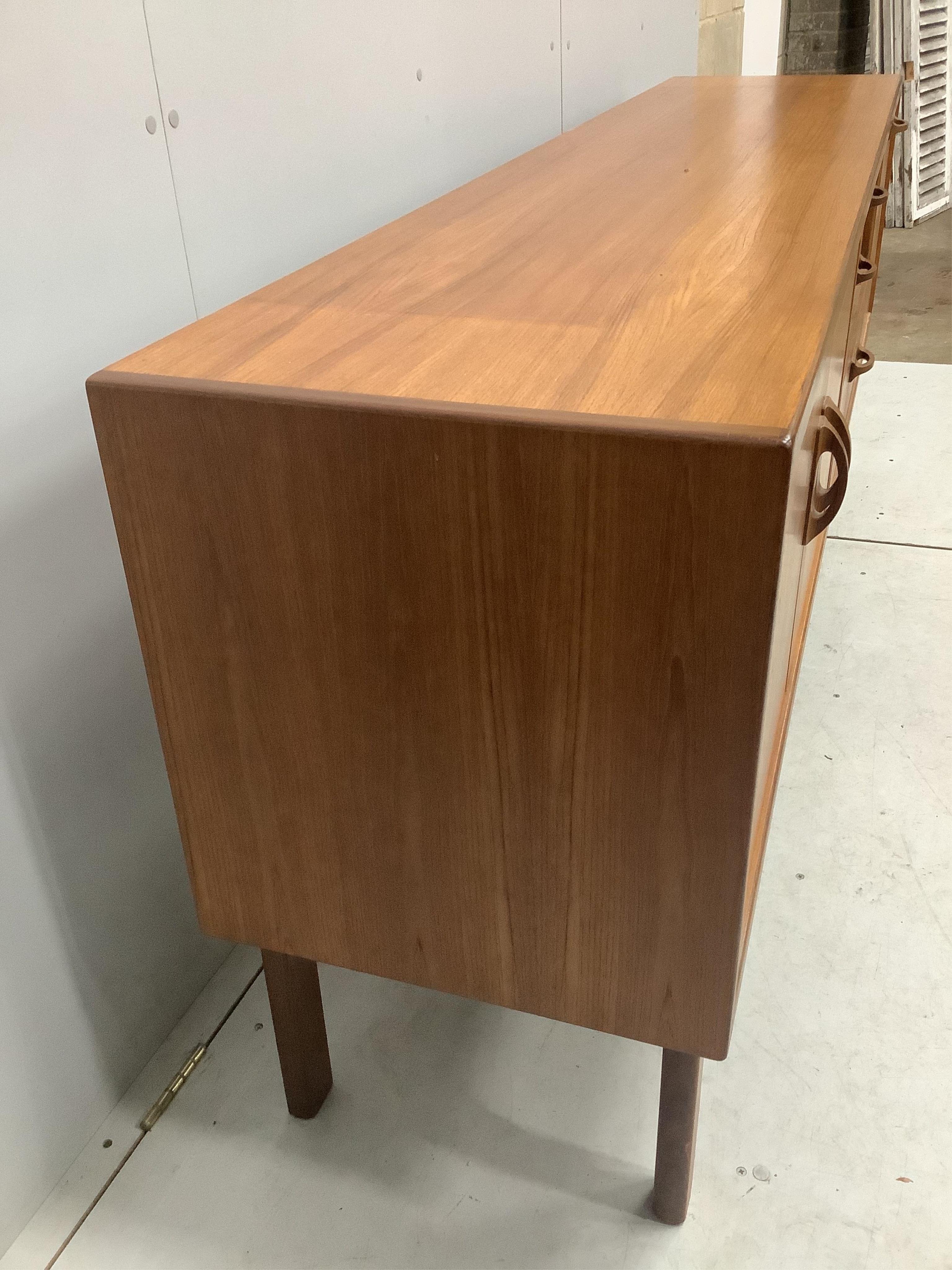 A mid century G Plan Sierra teak sideboard, width 205cm, depth 45cm, height 80cm. Condition - fair to good, some fading to top